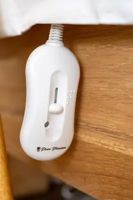 a white computer mouse sitting on top of a table at Nine Palms 223B in Cape Town