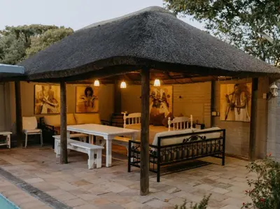 a pavilion with a table and a table and chairs at Cape Select Luxury Accommodation in Durbanville