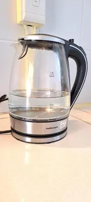 a glass kettle on top of a counter at Stylish 2-Bed Flat with Exclusive Patio - Easy Access to Cape Town Highlights in Cape Town