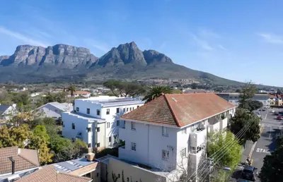 a view of cape town with mountains in the background at Stylish 2-Bed Flat with Exclusive Patio - Easy Access to Cape Town Highlights in Cape Town