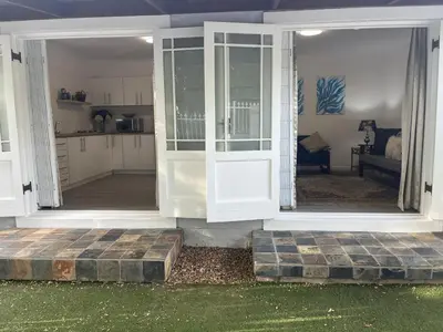 an open door of a house with a kitchen at Mozart Close Durbanville- for people who needs space in Durbanville