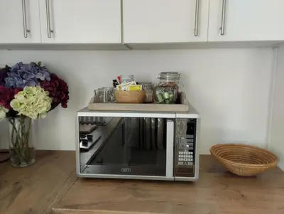a microwave oven with a tray on top of it at Mozart Close Durbanville- for people who needs space in Durbanville