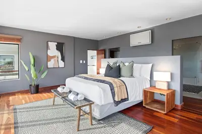a bedroom with a large white bed in a room at Restio View 11 in Cape Town