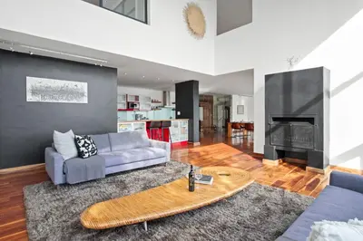 a living room with a couch and a table at Restio View 11 in Cape Town
