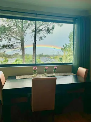 a window with a table and two chairs in front of it at Villa Silver Vos in Hermanus