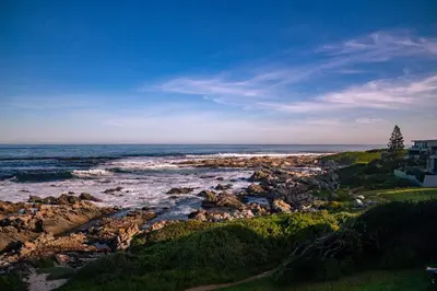 a view of a rocky beach with the ocean at Seascape, Vermont Retreat in Hermanus