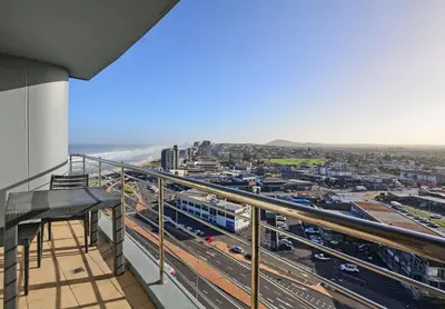 a view of a city from the balcony of a building at Private Blouberg Beachfront Getaway in Cape Town