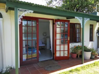 an open door of a house with a patio at Cape Explore in Cape Town