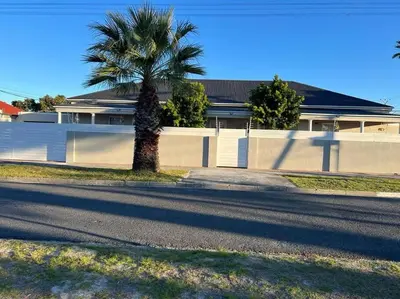 a palm tree sitting on the side of a street at Serena Inn Apartment no5 Self Catering in Cape Town