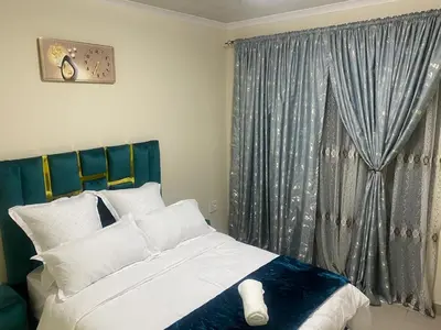 a bedroom with a bed and a window at Sabbath Lodge VIP in Cape Town
