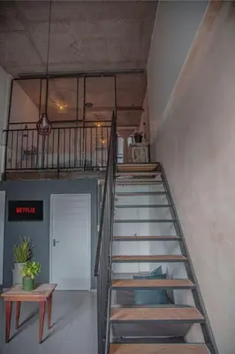 a spiral staircase in a room with a stair case at Kape Loft in Cape Town