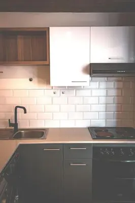 a kitchen with a sink and a stove at Kape Loft in Cape Town