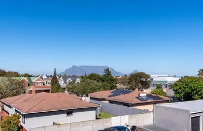 a group of houses in a town with roofs at Affordable Luxury in Cape Town