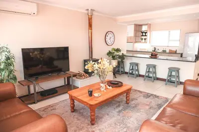 a living room with a couch and a coffee table at Hermanus Reefs in Hermanus