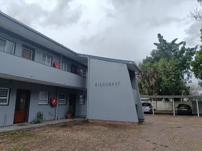 a building with a sign on the side of it at #Spacious Cozy Stay- Free parking in Stellenbosch