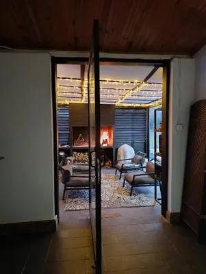a view of a living room with a fireplace at Villa Villiers in Villiersdorp