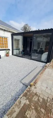a house with a gravel yard in front of it at Villa Villiers in Villiersdorp