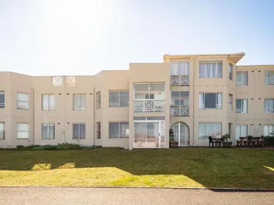 an exterior view of a large apartment building at Seaside Serenity in Hermanus
