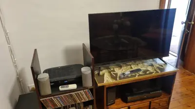a entertainment center with a fish tank and a tv at Château Naudé in Stellenbosch Free Secure Parking in Stellenbosch