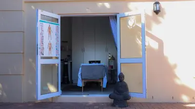 a door open to a room with a table at Somerset Garden Route Apartments & Wellness in Somerset West