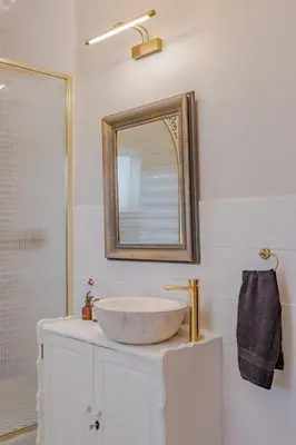 a bathroom with a sink and a mirror at Blue Bell in Hermanus