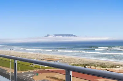 a view of the ocean from the balcony of a condo at Sea Spray A410 in Cape Town