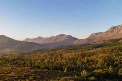 a view of a valley with mountains in the background at Heuwels in Blauwvlei