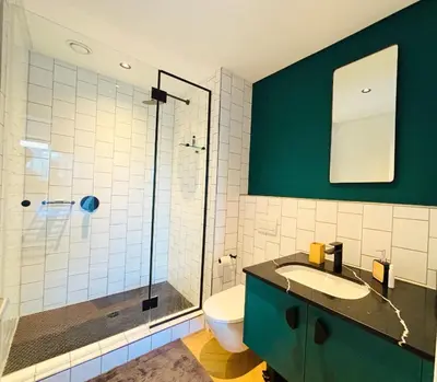 a bathroom with a toilet and a sink and a shower at ZALS Luxury Accommodation-One bed-Cape Town in Cape Town
