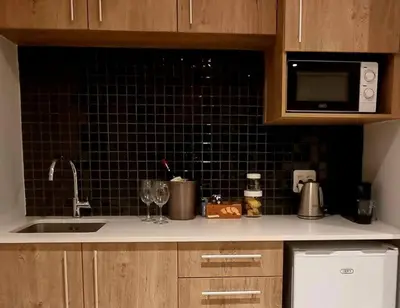 a kitchen counter with a sink and a microwave at C'est la Vie 3 in Franschhoek