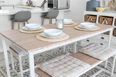 a kitchen with a wooden table and chairs at Odeon Towers 1102 in Cape Town