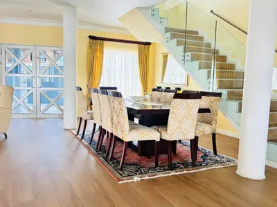 a dining room with a table and chairs at KBJ House in Cape Town