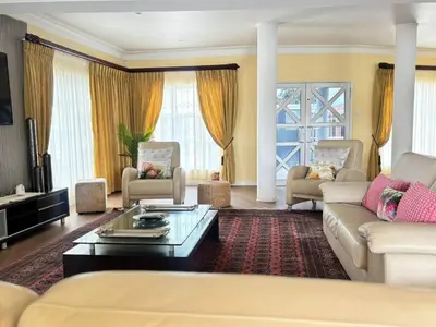 a living room with couches and a coffee table at KBJ House in Cape Town