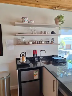a kitchen with a sink and a counter top at Governor's nest in Cape Town