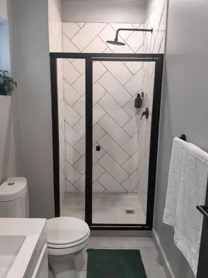 a bathroom with a shower with a toilet and a sink at Ultra-Modern Studio Apartment in Table View