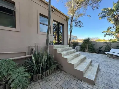 a set of concrete stairs next to a house at Room With A View in Windsor Park