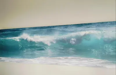 a large wave in the ocean on a beach at C es Cape in Pringle Bay