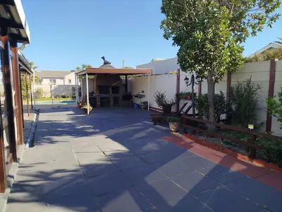 a patio with a table and a pavilion at Mountain View Apartment in Cape Town