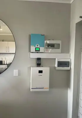 a white kitchen with a mirror and a counter at Two Bedroom Luxury Apartment, Century City - BackUp Power in Cape Town