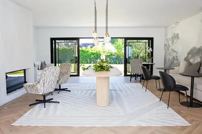 a living room with a table and chairs at Coco Queen in Paarl