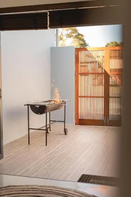 a room with a table with a fire in it at The View Guesthouse & Cottage in Caledon