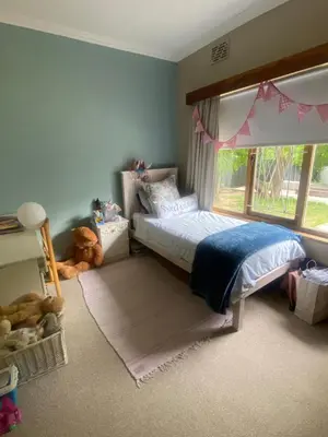 a childs bedroom with a bed and a window at 33 Tafelberg! in Cape Town