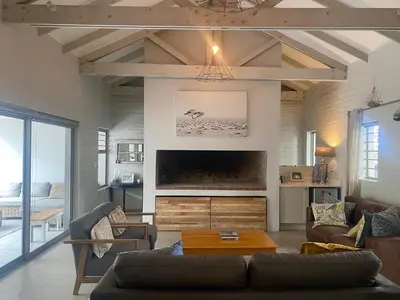 a living room with a couch and a table at 33 Tafelberg! in Cape Town