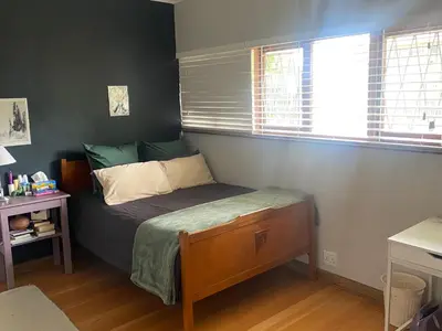 a small bedroom with a bed and a window at 33 Tafelberg! in Cape Town