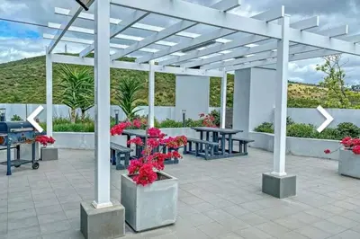 a pavilion with tables and flowers on a patio at Luxury at The Den in Stellenbosch