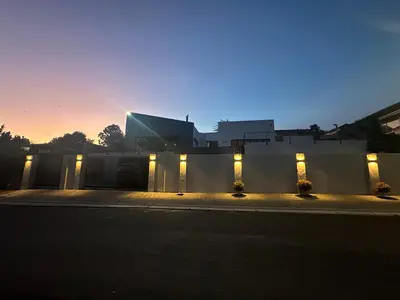 a building with lights on the side of a street at Somerset-West PRIME SPOT- Solar Powered! in Cape Town