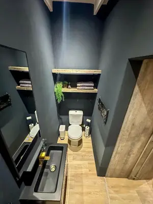 a bathroom with a toilet and a sink at Somerset-West PRIME SPOT- Solar Powered! in Cape Town