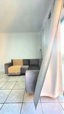 a living room with a couch and a window at Aeon Nest in Parow