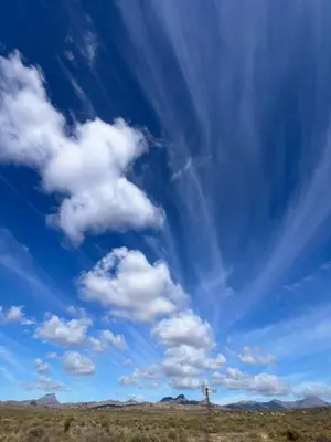 a blue sky with white clouds in the desert at Big6 Guesthouse in Somerset West