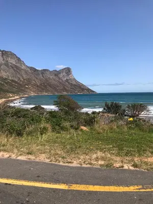 a view of a beach with the ocean at Awesome room in surf house in Hermanus