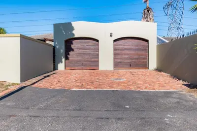 two garage doors on the side of a house at 59onLetchworth in Cape Town